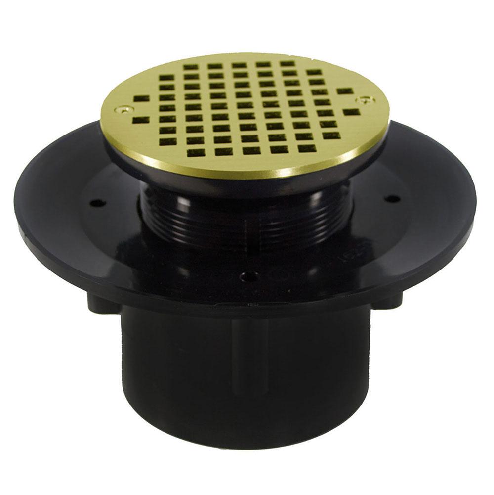 Jones Stephens 3'' x 4'' Heavy Duty ABS Slab Drain Base with 3-1/2'' Plastic Spud and 6'' Polished Brass Strainer